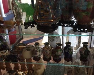 A close look at the cloisonne pieces, small tea set, seals, hand painted eggs