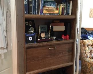 Bookcase, lots of office supplies, books