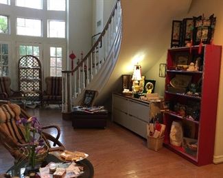 Red bookcase, metal credenza style filing cabinet, panels, lanterns, art work
