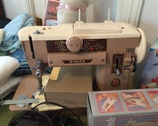 Singer sewing machine with attachements