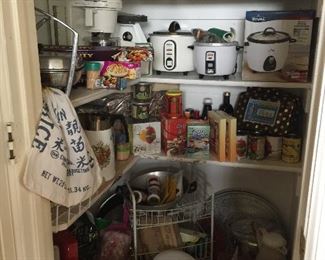 In the Pantry you will find lots of small appliances, new sauce pans, and woks