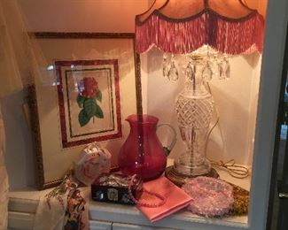 Cut glass lamp with prisms, textiles, evening purses