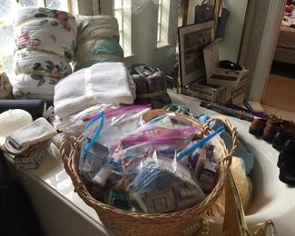 Lots of bathroom toiletries, blankets and quilts