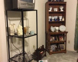 Tv, Tv stand, shelf with collectibles in master bedroom 