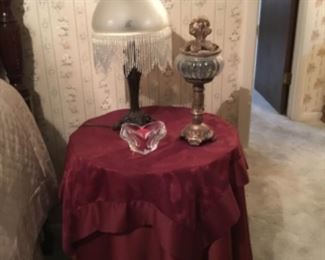 Round covered table & lamp with decor.  Table in later picture