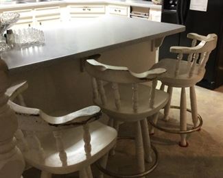 Three heavy bar stools