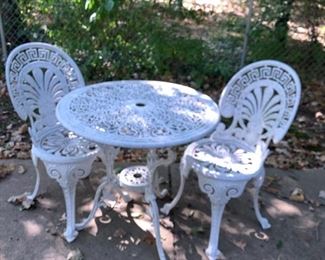Cast iron table and two chairs