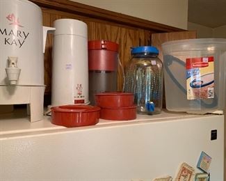 Assortment of Mary Kay items including percolator. Ice tea maker, Sun Tea jars, and Rubbermaid containers