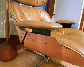 Detail of Plycraft Eames-style chair with footrest; Pair Plycraft Eames-style chairs with footrests. $750 each. 