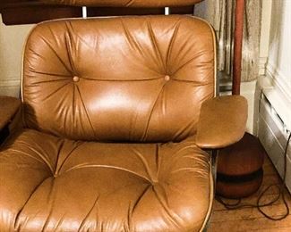 Detail of Plycraft Eames-style chair with footrest; Pair Plycraft Eames-style chairs with footrests. $750 each. 