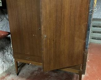 Danish modern cabinet. It does need some TLC: it has missing trim pieces on the bottom right drawer. The shelves inside are adjustable. It locks, and the key is present! $195