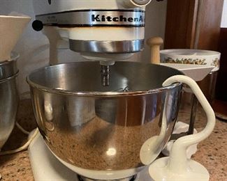 Kitchenaid mixer with 2 extra bowls, splash guard, dough hook, paddle, whisk, and grinding attachment $125
