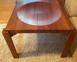 Teak side table with concave top, flip it over and you have a flat top! As you can see in this picture, the wood is a bit dry, and there's a split forming between two pieces of wood. As is, $85