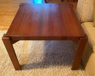 Teak side table with concave top, flip it over and you have a flat top! As you can see in this picture, the wood is a bit dry, and there's a split forming between two pieces of wood. As is, $85