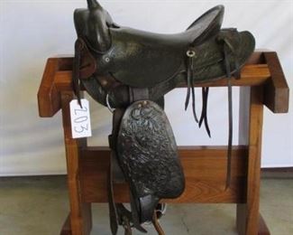 203	

Vintage Cowboy Saddle
Vintage 15 1/2"  Western Ranch Saddle.  Saddle comes with cinch, latigo, breast collar and string ties. Saddle is in using condition