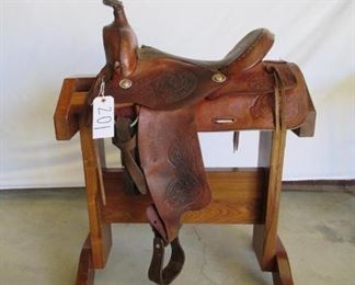 201	

Cowboy Ranch Saddle
Western Ranch Saddle. 16 inch seat.  Saddle complete with latigo, cinch and string ties. Saddle is in using condition.