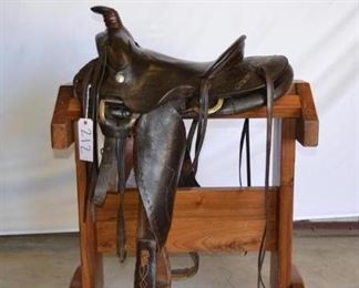 212
Vintage Cowboy Saddle
Vintage Western Saddle 13 1/2". Comes complete with front cinch, latigo, string ties and Buffalo Nickel conchos shown in photos. Maker is marked in picture.