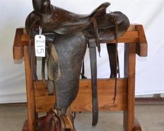 215
Vintage Western Saddle
14" Vintage Western Saddle. Saddle comes complete with latigo, string ties, back cinch and very large custom carved tapaderos.