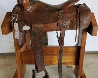 233
Western Riding Saddle
15 1/2" Western Riding Saddle. Has latigo. Needs some repairs.
