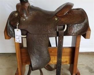 243
Longhorn Western Roping Saddle
15" Longhorn western Roping Saddle. Front and back cinches. Vintage silver conchos and horn plate. In riding condition. Has makers mark on saddle.