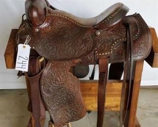244
Cowboy Roping Saddle
16" western roping saddle. Has a complete rigging. The breast collar is a Billy Cook. Nice buck stitching in the seat. Saddle is in working condition. Small tear on left side fender, see photos.