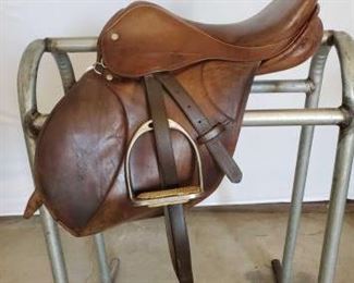 190
E. Jeffries Sadderlery English Saddle
16" E. Jeffries Saddlery English Saddle. Goold Co. Walsall. Serial # 16377. English saddle is complete with stirrup leathers, iron stirrups, girth and saddle pad. Has all the makers marks This saddle is in very good condition.