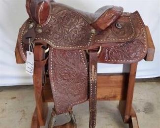 279
Cowboy Western Saddle
15 1/2" Cowboy Western Saddle. Serial # 502. Lots of buck stitching all around. Vintage conchos. Complete rigging. Ready to ride.
