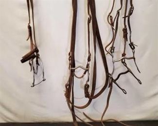 158
Four Assorted Bridles with Bits and Hackamore Bit
Four Assorted Used Bridles with Bits and Hackamore Bit. Some complete bridles and some missing parts