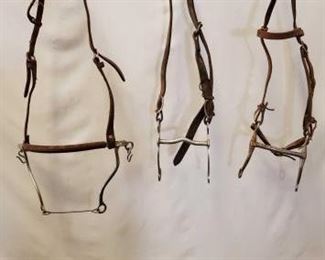 164
Three Assorted Cowboy Bridles and Parts.
Three Assorted Cowboy Bridles and Parts.