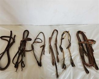 128
Lots of Just Good Headstalls and Set of Reins
Lots of Just Good Headstalls and Set of Reins
5- Good leather headstalls all for one money
Some with rawhide and some with silver conchos