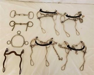 382
8 Different Types of Bits
1- Training Bit Side Pull Stamped Made in England (See picture)
1- Snaffle Bit with Dog Bone Mouth Piece
1- English Snaffle (possibly)
1- Vintage Curved Bit with Silver Engraved Accents on shanks (see pictures)
4- Combination Long Shanked Hackamores Gag Bits with twisted wire broken mouth pieces