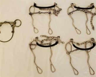 383
5 Misc Bit Lot
1- English Training Bit with Nose Training Band
4- Combination Long Shank Hackamore Gag Bits with Twisted Wire Broken Mouth Pieces. New some with tags still attached.