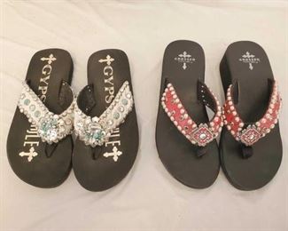 Two Pairs of Swarvoski Crystal Embellished Gypsy Soule Flip Flops Size 9
Hard to find Gypsy Soule Flip Flops
1- One pair of Crossed By Gypsy Soule Small Wedge Flip Flops in size 9. Featuring Red Gator straps with black diamond Swarovski crystals and silver dots. Custom concho in the center of the flip flop with red Swarovski crystals accents.
1- One pair of Gypsy Soule Flip Flops in size 9. Adorned with silver metallic hide, clear Swarovski crystals and turquoise stones on the straps. The center flower conchos are covered in both large and small clear Swarovski crystals and medium and small turquoise stones with silver dots lining the straps.
Both pairs are in excellent condition, one being brand new and one in like new condition.
