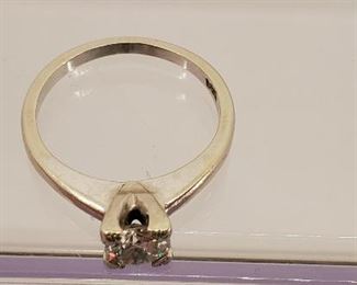 14k white gold and tested diamond ring