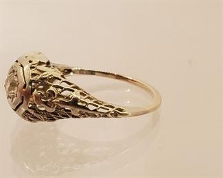 18 K white gold filigree ring with tested diamond