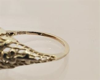 18 K white gold filigree ring with tested diamond