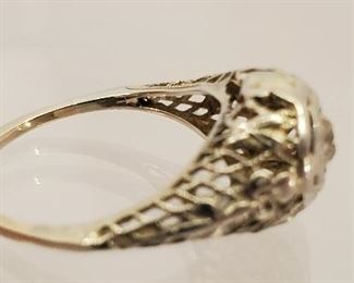 18 K white gold filigree ring with tested diamond