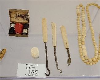 Mixed lot of antique bone button hooks, beads and souvenir of Alaska.