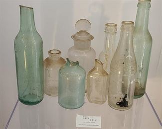 Mixed lot of antique of bottles dug out of the ground. Please view for condition and type of bottle.