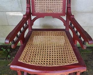 Antique gothic revival arm chair possibly walnut with replacement caned seat, original paint.