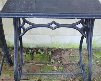Heavy metal base table with wood top. Base is from the Valentine Meat Juice factory