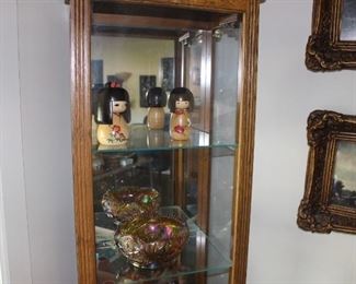 Side open display cabinet with multiple glass shelves, lighted
