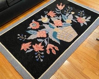 Pretty hooked floral rug.
