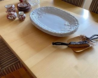 Large dining table with self storing leaves and 6 chairs .