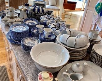 Several beautiful china sets.