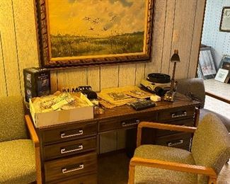 Office desk and two chairs.