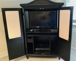 Full size Armoire or in this case Entertainment center. 