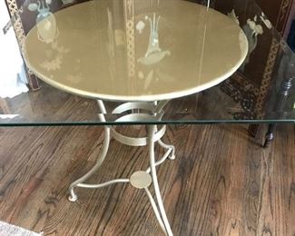 Metal table with beveled glass top.