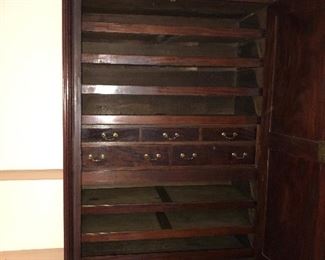Interior of previous armoire.  Center double belt of drawers, and shallow linen drawers above and below.  91 1/2” high by 61” wide, by 26” deep.  