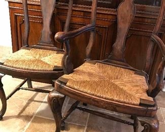 Set of eight Italian walnut hand carved dining chairs with rush bottoms 